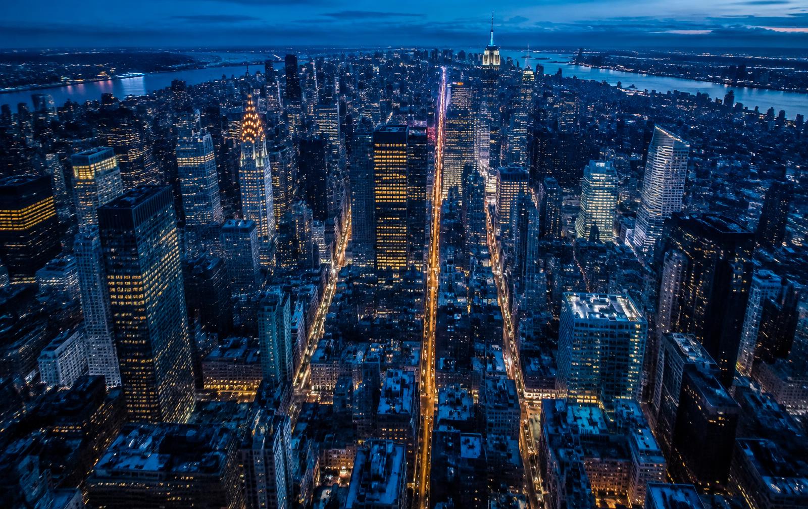 Midtown Manhattan avenues lit at dusk